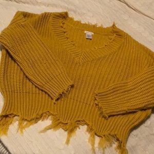 Mustard knit sweater with frayed hem